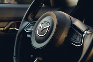 A steering wheel and dashboard of a car