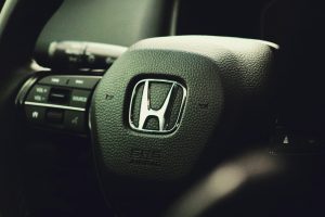 a close up of the steering wheel of a car