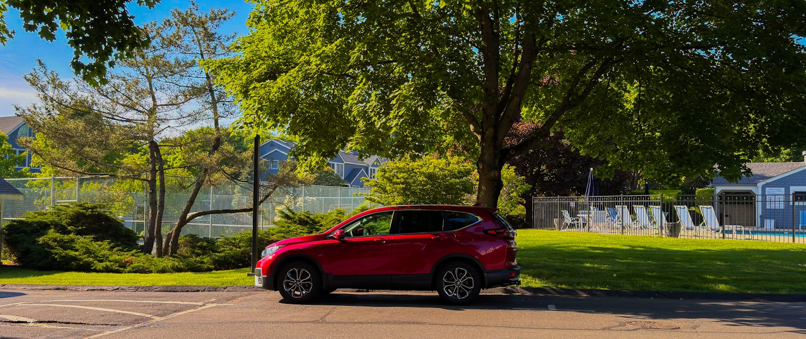 a red car parked on the side of the road