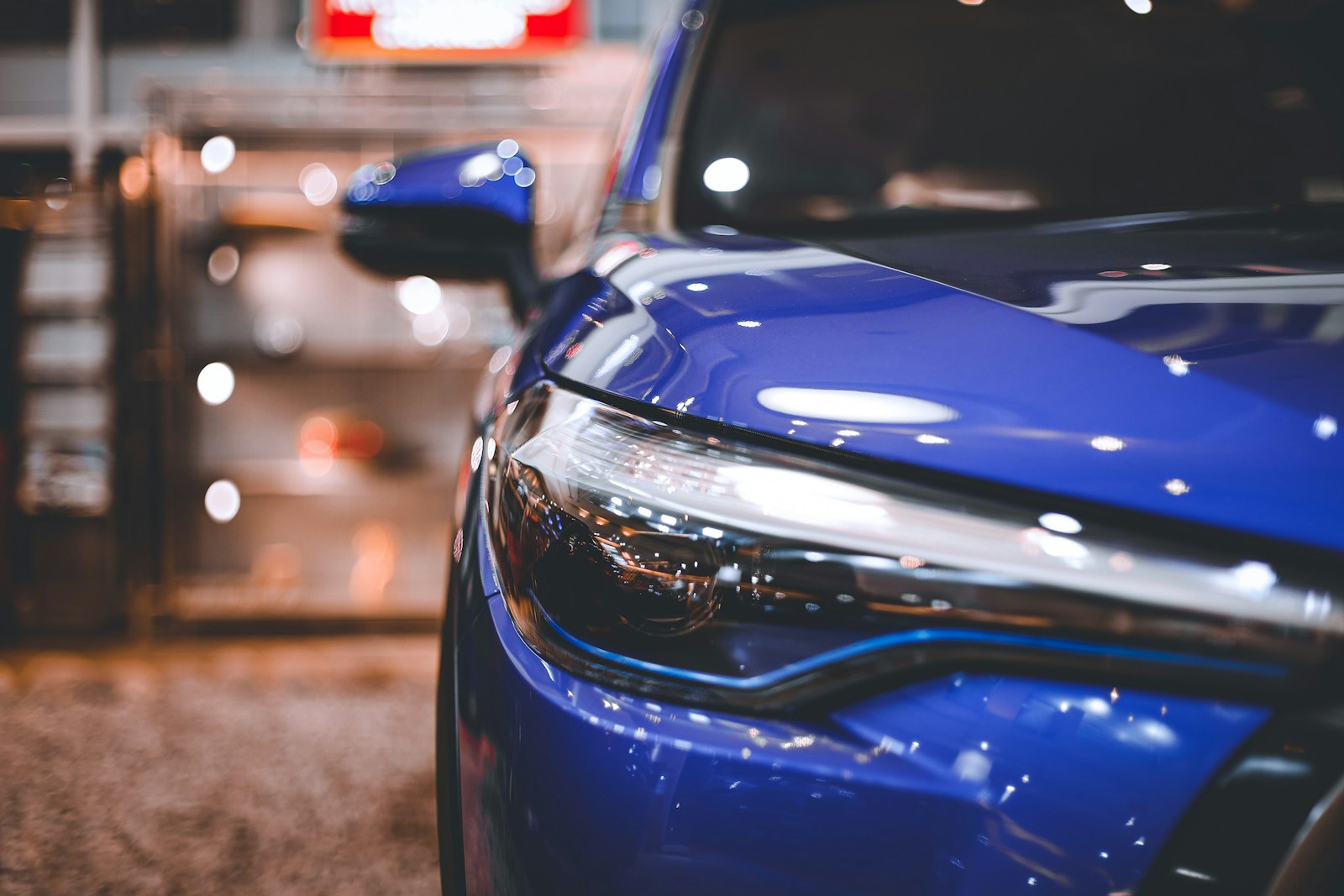 a close up of the front of a blue car